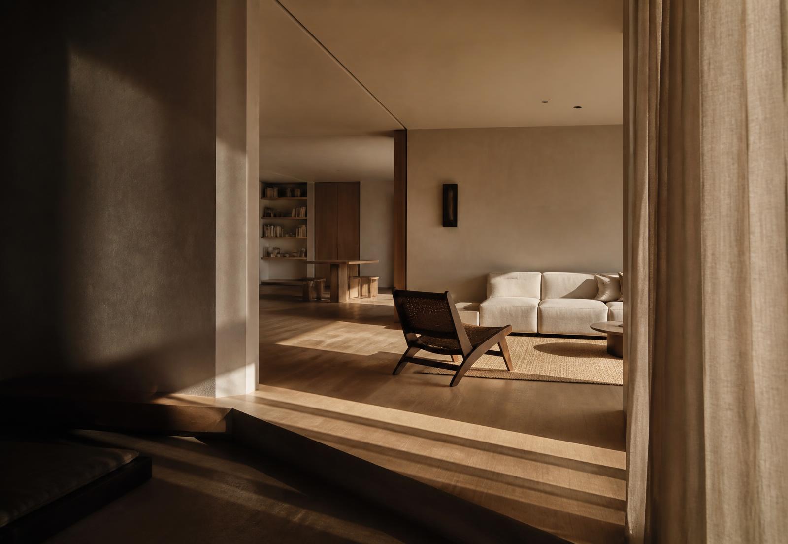 Sunlit minimal interior with warm oak floors